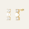 bridal earrings with pearls and diamonds. there are three stones. a zirconia stone, then a pearl and then a zircona stone. 