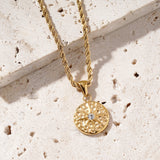 Designed by Mettle and Bloom to mirror the points of a compass, the Intuition Necklace is a quiet reminder that while maps can guide you, true direction often comes from within. Staying true to Mettle and Bloom's signature style, it is set on a softly hammered round pendant. The raised star motif draws the eye with its refined shape and the radiant centre stone captures the gaze.
