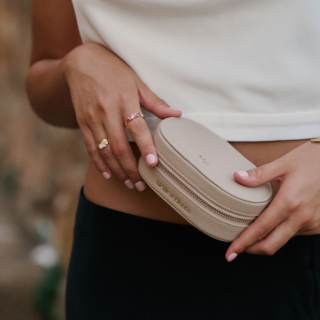 Person holding a luxury jewellery storage case with a blurred background
