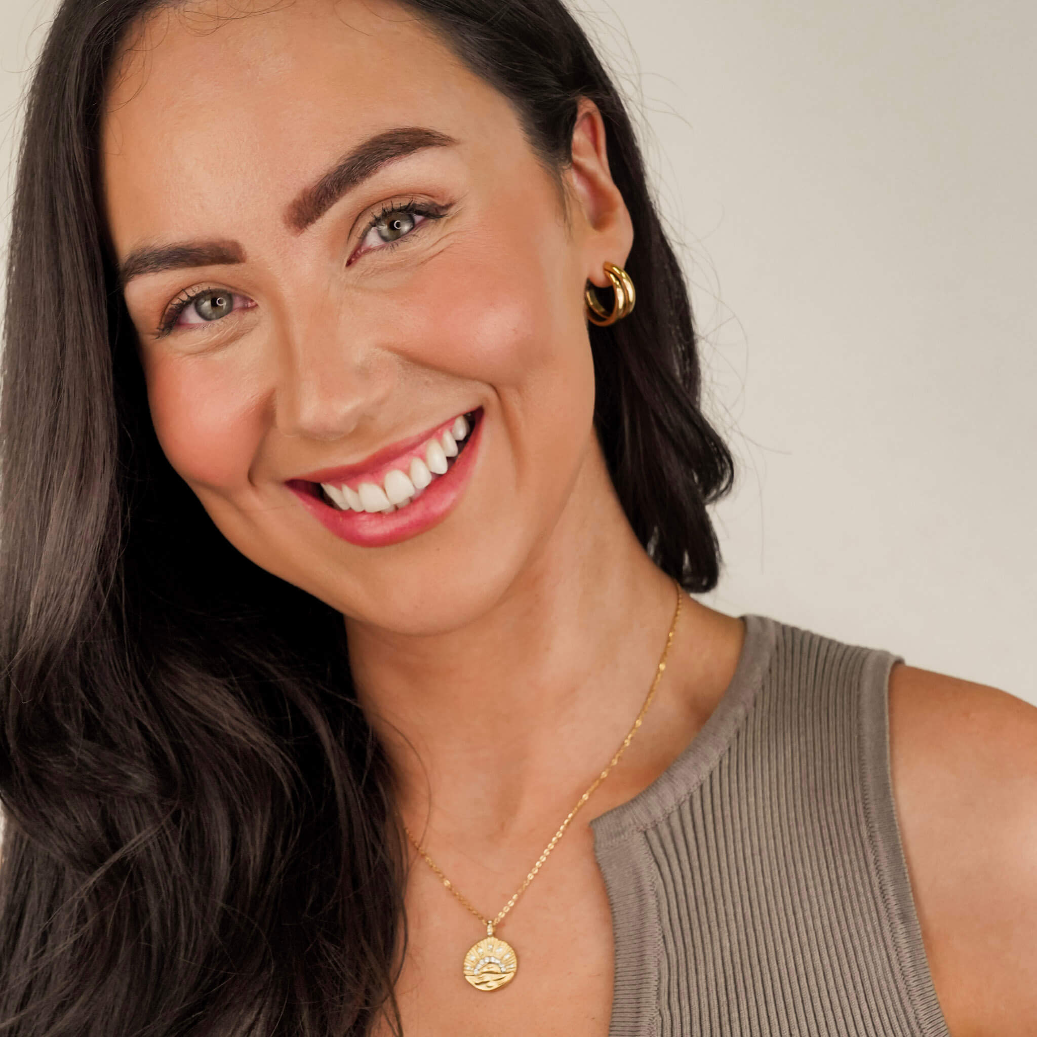 The 'Muse Hoops' from Mettle & Bloom - a pair of double band gold hoop earrings. Crafted with precision, the hoops feature a steel-plated finish for durability and a lustrous appeal. A seamless blend of timeless elegance and contemporary style, these earrings offer a versatile accessory to elevate your look. Available now at Mettle & Bloom, the Muse Hoops embody modern sophistication with their exquisite design.