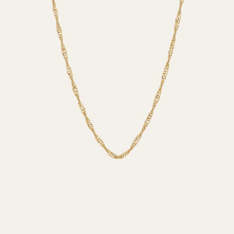 A delicate and thin gold singapore chain necklace with a twisted, rope-like link design, displayed against a solid off-white background.