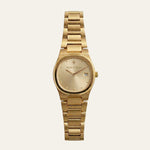 A gold-tone metal wristwatch with a matching link bracelet, featuring a champagne-gold dial with a date window and the 'Mette & Bjoern' brand name printed on the face, set against a solid off-white background.